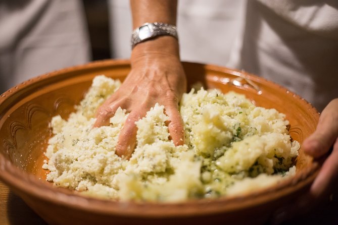 Cooking Class in a Secret Courtyard - Culurgiones (Sardinian Pasta) - The welcome, aperitif, and table