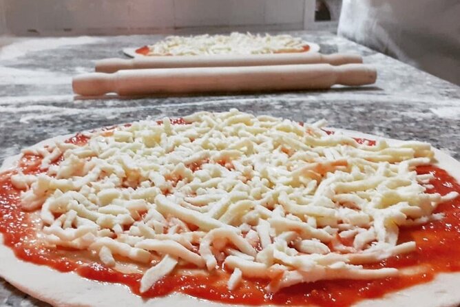Cooking Class in the Heart of Rome: Pizza and Tiramisu Making - Sitting down to eat your own work