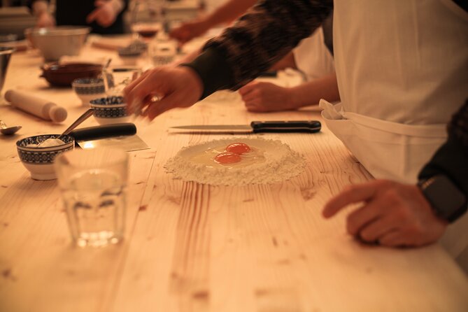 Florence: Flambé Cheese Wheel Truffle Pasta Class & Tiramisù - An elegant setting with a lively feel