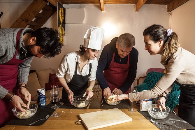 Fresh Homemade Pasta and Tiramisu Cooking Class in Milan - Eating your own meal with wine and water