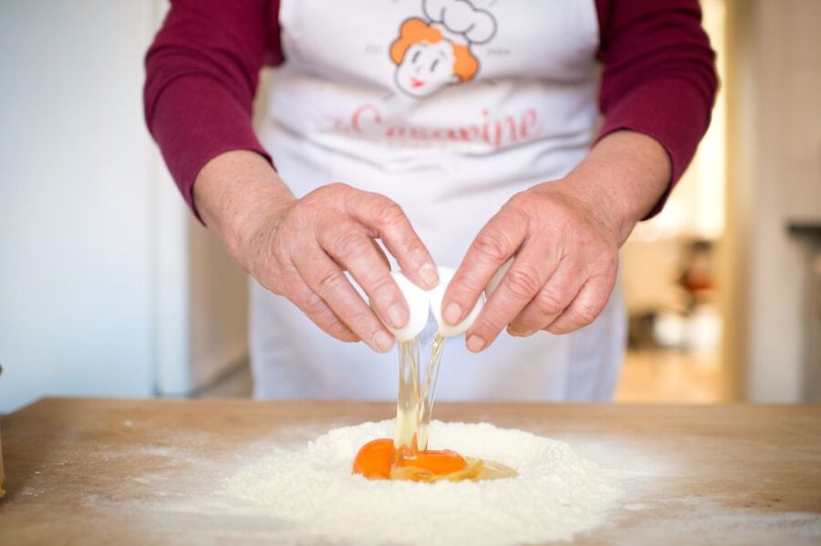 Lucca: Fresh Pasta-Making Class at a Local's Home - Eating what you make, with wine on the table