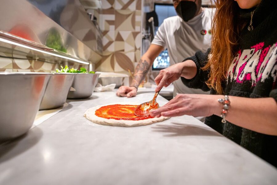 Naples: Authentic Neapolitan Pizza Making Class - Your turn to stretch and top the pizza