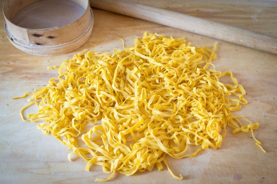 Naples: Private Pasta and Tiramisu Class at a Local's Home - Cooking pasta in a Campania home