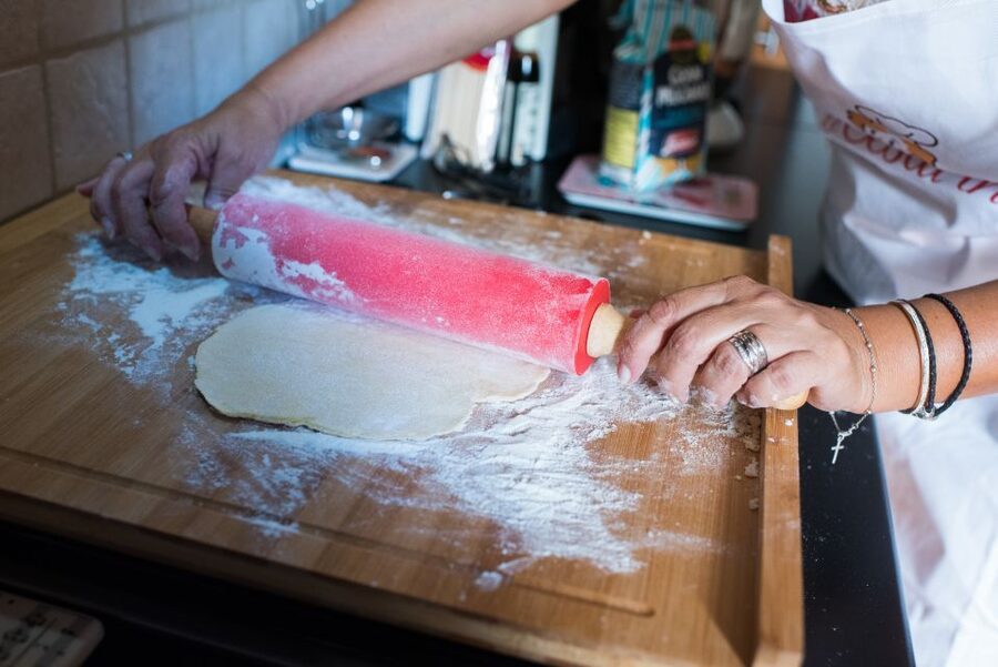 Parma: Pasta and Tiramisu Class at a Local's Home - Cooking pasta inside a Parma family home