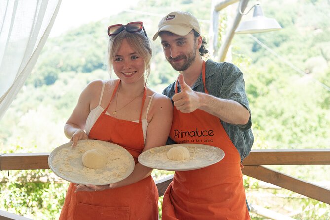 Pizza School with Wine and Limoncello Tasting in a Local Farm - Baking your pizza in the wood-burning oven