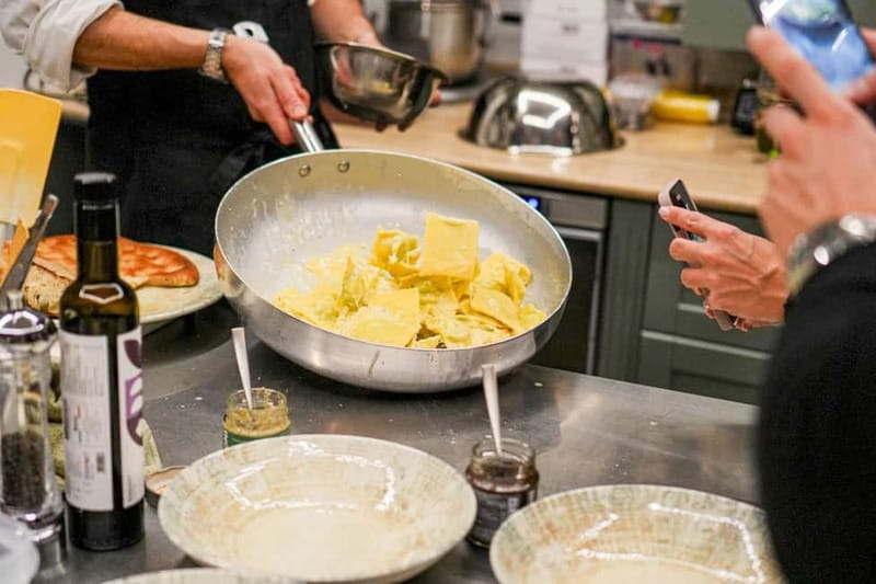 Rome: Hands-On Pasta & Tiramisu Class with Unlimited Wine - Sitting down to eat with unlimited Italian wine