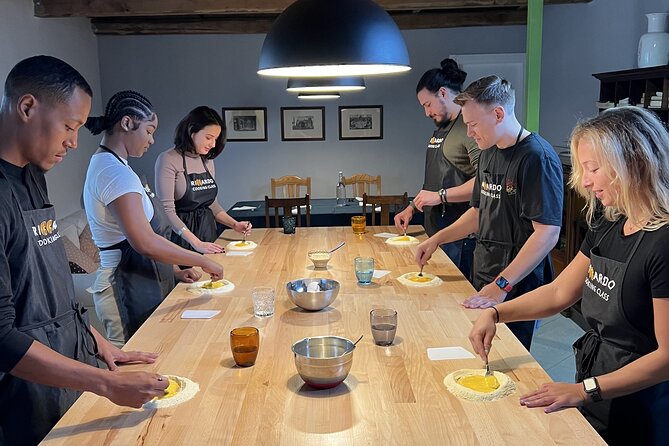 Rome Pasta Making Class with Italian Sauces and Wine Included - Rolling dough and shaping three pasta styles