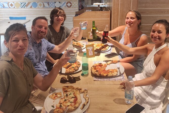 Semi-Private Pizza Making Experience in Naples with Drink - Eating your pizza with a drink
