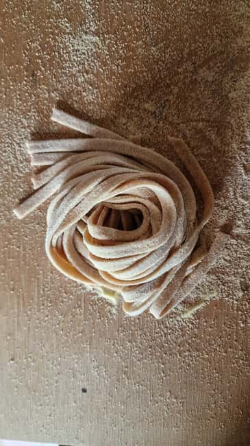 Siena: Private Handmade Pasta Cooking Class in Tuscany - Sitting down to a Tuscan meal with wine