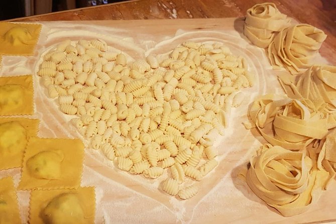 Small Group Cooking Class in Rome: Handmade Pasta - Lunch at a table decorated with Italian film stars