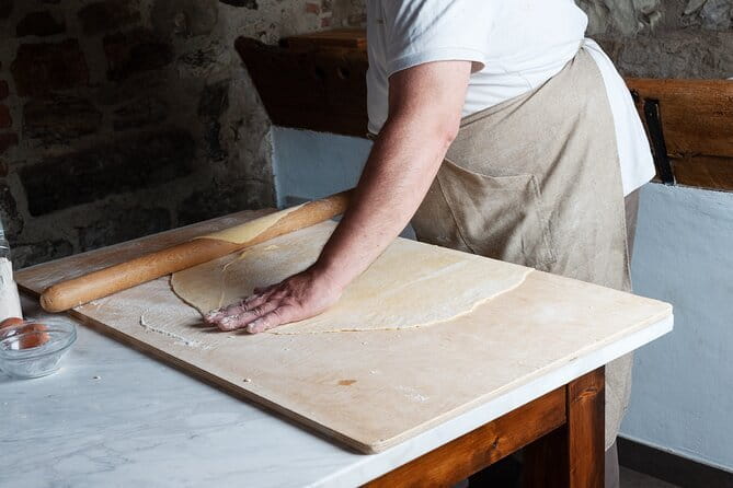 Small Group Pasta Making Class Wine Tasting in a Tuscan Castle - Walking through the castle cellars