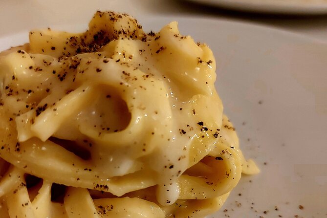 Small-Group Pasta Making steps from the Vatican Museums - Sitting down to eat what you made