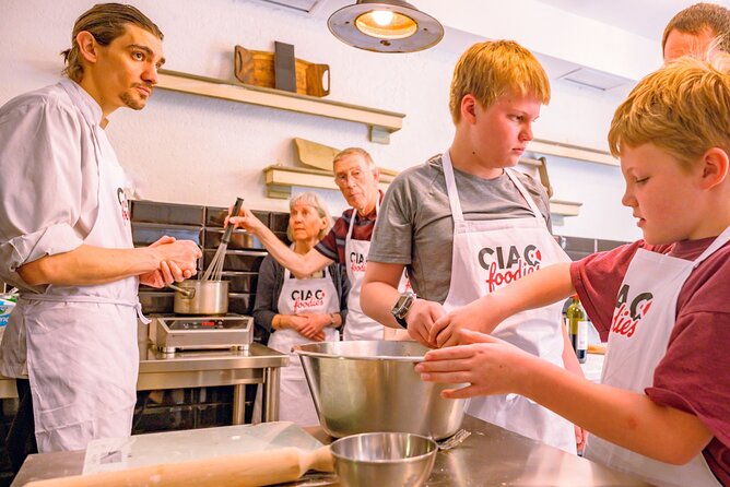 The Italian Way: Pizza and Gelato Class with Unlimited Wine - Baking your own pizza in a real oven