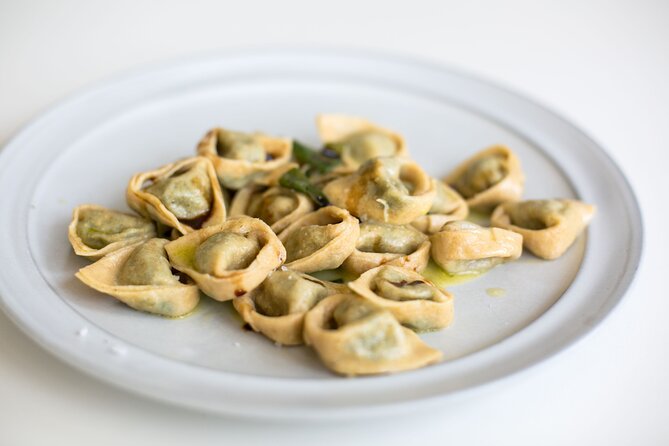 Tortelloni and Tagliatelle Cooking Class in Bologna + Wine - Wine, conversation, and the meal at the table