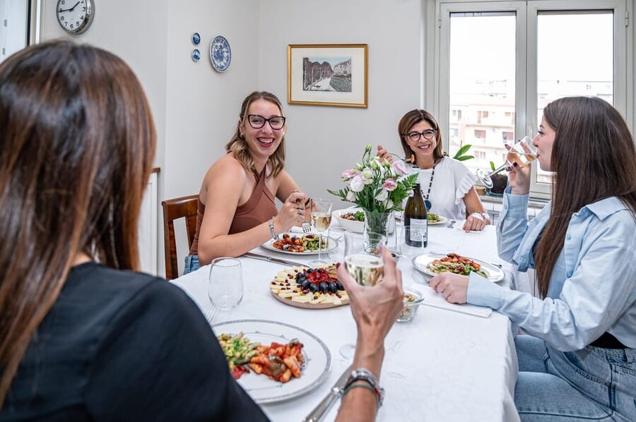 Verona: Prosecco and Pasta Making Class at a Local's Home - Sitting down to eat what you made